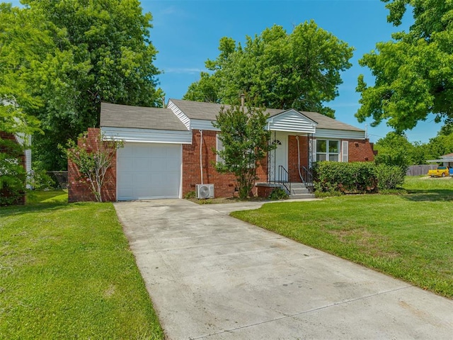 7235 SE 15th St, Midwest City, OK 73110 - view of front of property featuring brick siding, a garage, concrete driveway, and a front lawn