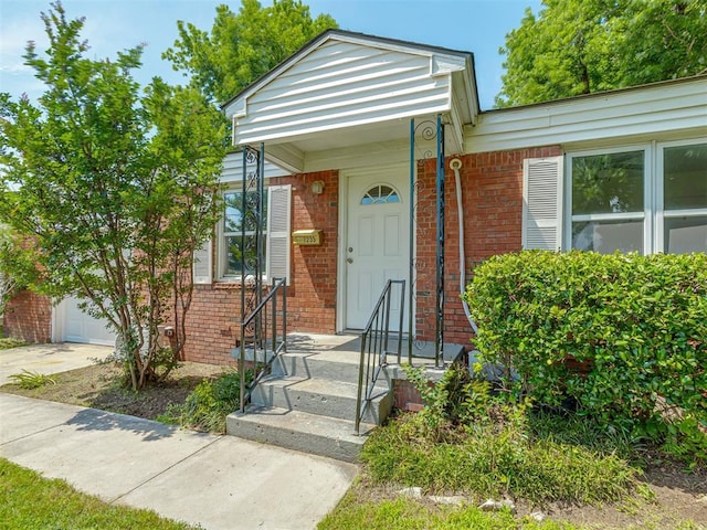 7235 SE 15th St, Midwest City, OK 73110 - view of front facade with brick siding, driveway, and an attached garage