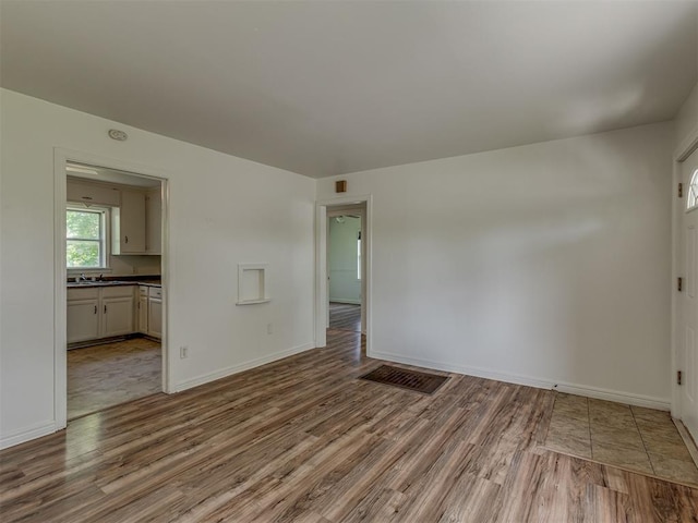 7235 SE 15th St, Midwest City, OK 73110 - unfurnished room with wood finished floors and baseboards