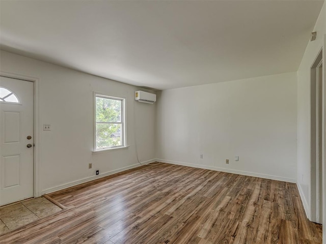 7235 SE 15th St, Midwest City, OK 73110 - entrance foyer with wood finished floors and a wall mounted AC