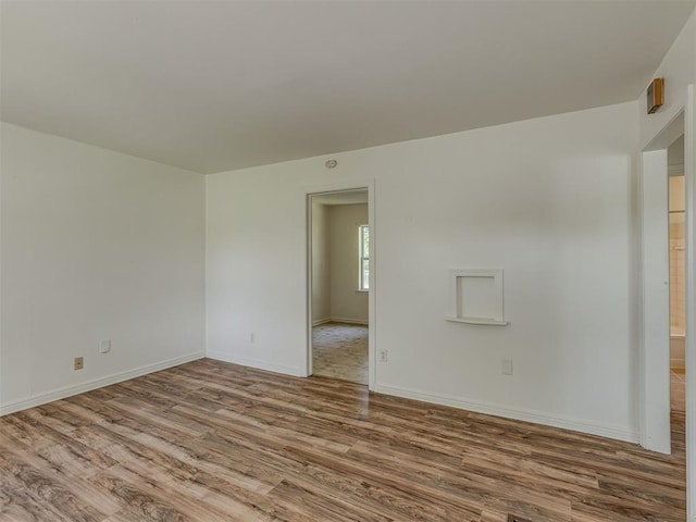 7235 SE 15th St, Midwest City, OK 73110 - unfurnished room with wood finished floors and baseboards