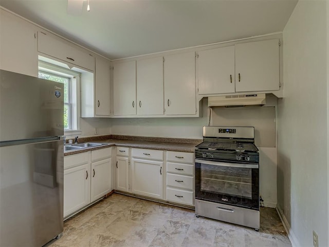 7235 SE 15th St, Midwest City, OK 73110 - kitchen featuring stainless steel appliances, under cabinet range hood, dark countertops, and white cabinets