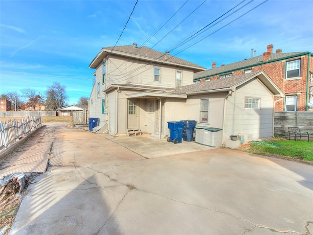 312 NW 24th St, Oklahoma City, OK 73103 - rear view of property with a patio and a fenced backyard