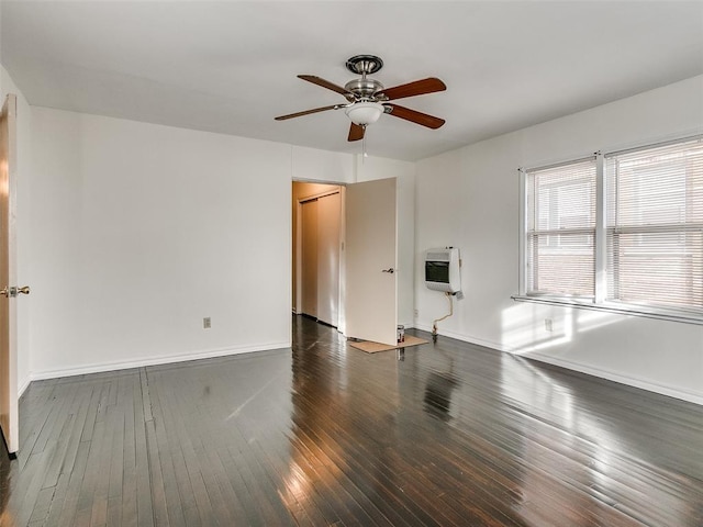 312 NW 24th St, Oklahoma City, OK 73103 - unfurnished room with heating unit, a ceiling fan, and hardwood / wood-style floors