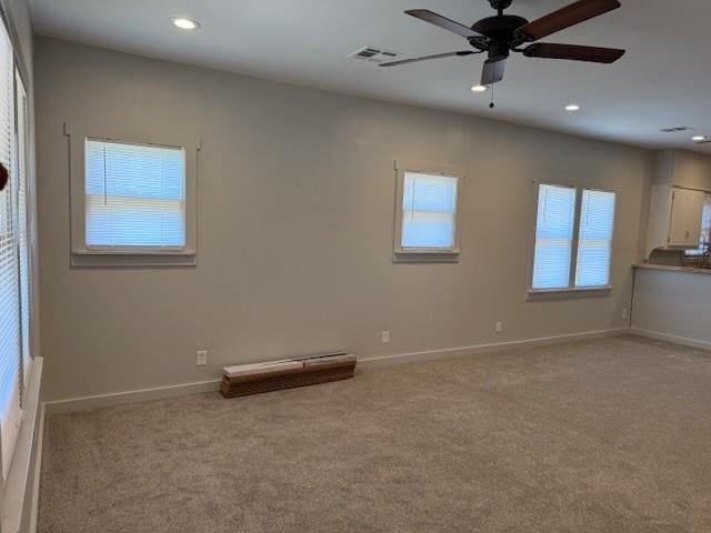 unfurnished room featuring carpet, ceiling fan, and recessed lighting