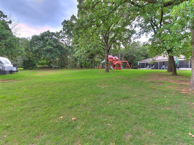 3908 Southwestern Ave, Edmond, OK 73034 - view of grassy yard with a playground