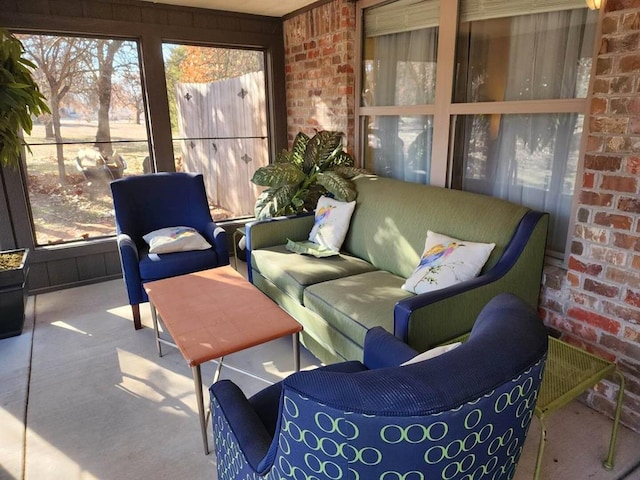 3908 Southwestern Ave, Edmond, OK 73034 - sunroom / solarium with brick wall, healthy amount of natural light, and an outdoor hangout area