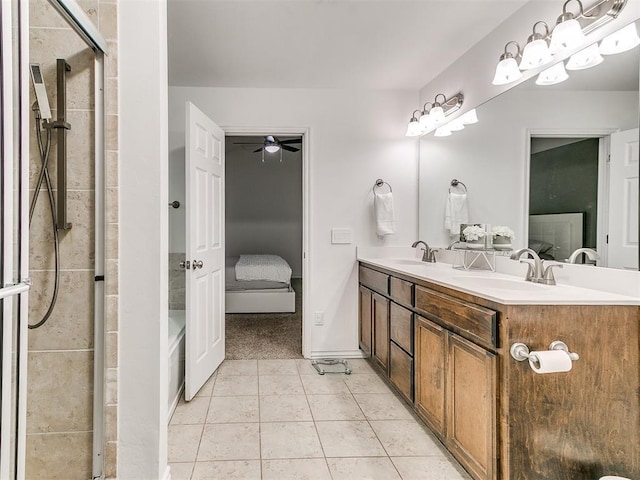 19940 Vivace Ct, Edmond, OK 73013 - ensuite bathroom with double vanity, a shower with shower door, tile patterned flooring, and a ceiling fan