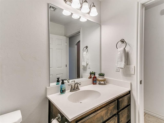 19940 Vivace Ct, Edmond, OK 73013 - bathroom featuring vanity and toilet