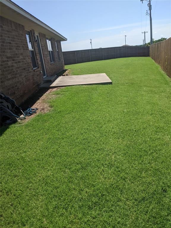19940 Vivace Ct, Edmond, OK 73013 - fenced backyard with a patio area