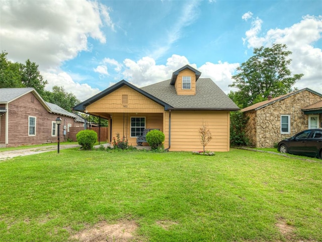 503 W Owens St, El Reno, OK 73036 - view of front of house with a front yard and roof with shingles