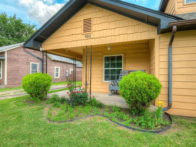 503 W Owens St, El Reno, OK 73036 - entrance to property with covered porch and a yard
