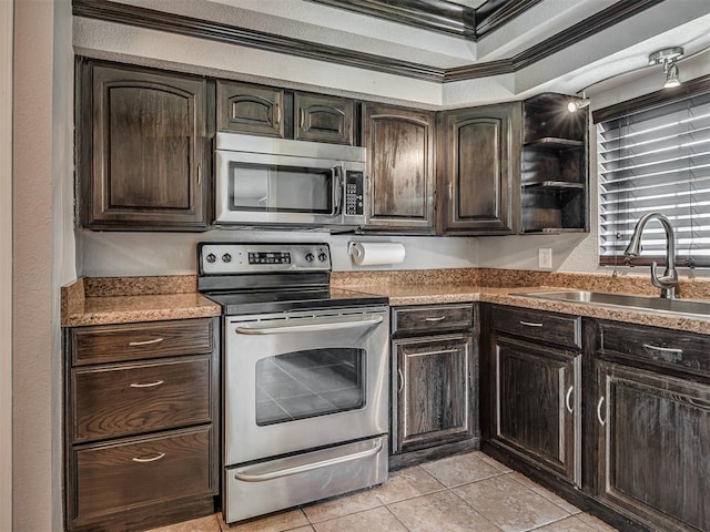 503 W Owens St, El Reno, OK 73036 - kitchen featuring stainless steel appliances, crown molding, dark brown cabinets, light tile patterned floors, and open shelves