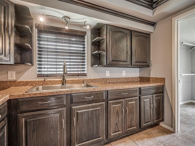 503 W Owens St, El Reno, OK 73036 - kitchen with open shelves, dark brown cabinetry, and light tile patterned floors
