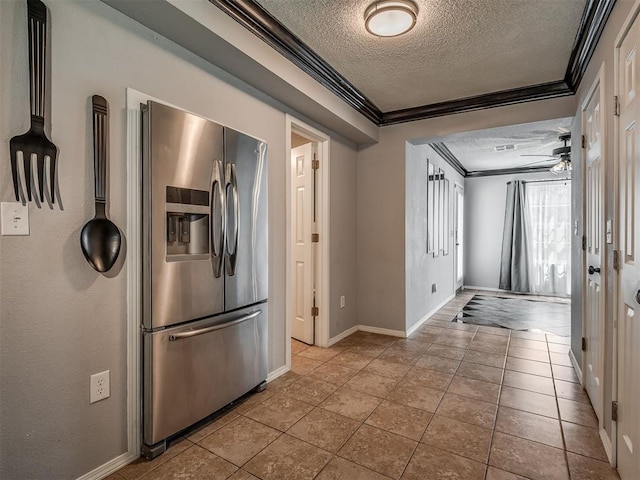 503 W Owens St, El Reno, OK 73036 - kitchen with stainless steel refrigerator with ice dispenser, a textured ceiling, ornamental molding, ceiling fan, and tile patterned flooring