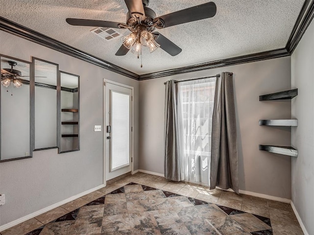 503 W Owens St, El Reno, OK 73036 - foyer with crown molding, a ceiling fan, and a textured ceiling