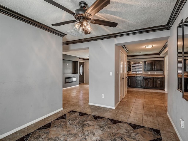 503 W Owens St, El Reno, OK 73036 - kitchen featuring ornamental molding, a textured ceiling, dark brown cabinetry, a ceiling fan, and tile patterned floors