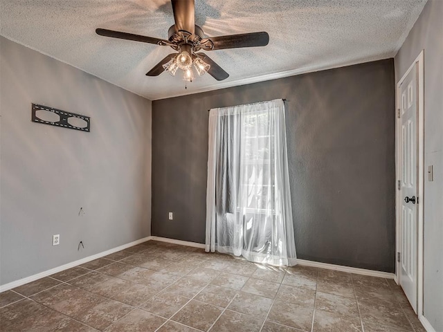 503 W Owens St, El Reno, OK 73036 - unfurnished room featuring a textured ceiling and ceiling fan