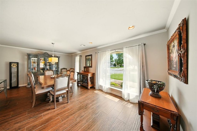 7617 N Ann Arbor Ave, Oklahoma City, OK 73132 - dining space with wood finished floors, ornamental molding, and recessed lighting