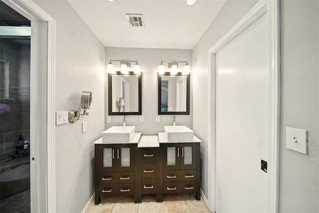 7617 N Ann Arbor Ave, Oklahoma City, OK 73132 - full bathroom with double vanity and baseboards