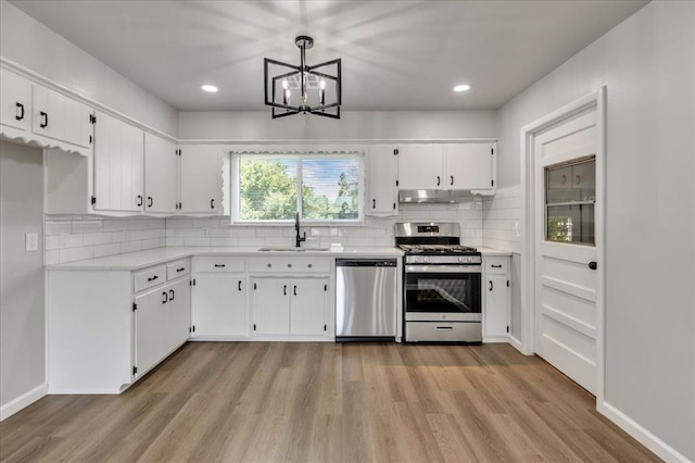 112 Asbill Ave, Yukon, OK 73099 - kitchen with stainless steel appliances, light wood-style flooring, white cabinetry, light countertops, and recessed lighting