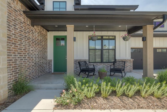 3824 Library Ln, Edmond, OK 73034 - entrance to property featuring covered porch, board and batten siding, and brick siding