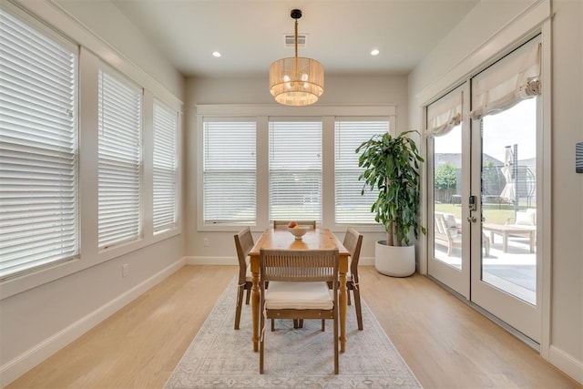 3824 Library Ln, Edmond, OK 73034 - dining room with french doors, light wood finished floors, a chandelier, and recessed lighting