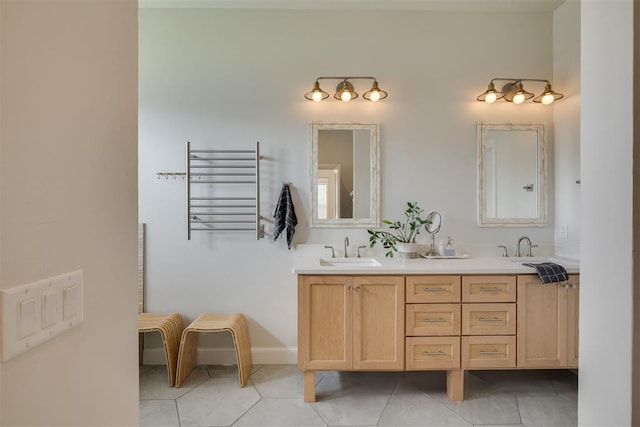 3824 Library Ln, Edmond, OK 73034 - full bath featuring radiator heating unit, tile patterned flooring, double vanity, and a towel warming rack