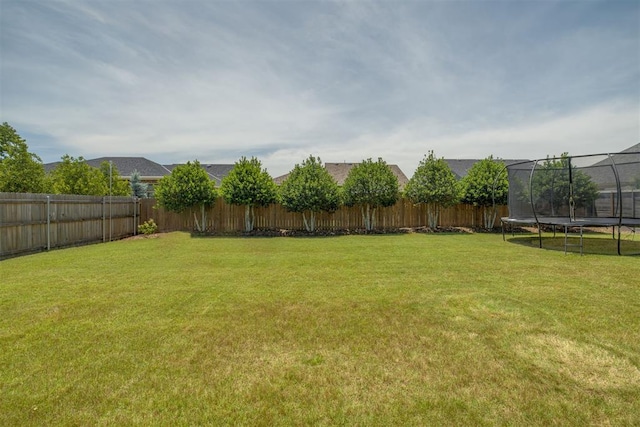 3824 Library Ln, Edmond, OK 73034 - fenced backyard featuring a trampoline