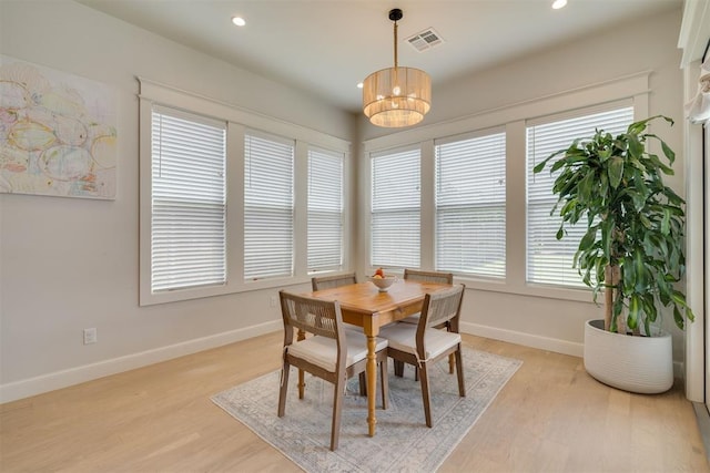 3824 Library Ln, Edmond, OK 73034 - dining room with light wood finished floors, a chandelier, and recessed lighting