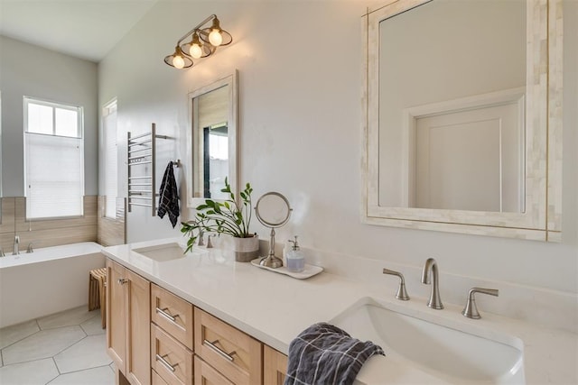 3824 Library Ln, Edmond, OK 73034 - bathroom featuring healthy amount of natural light, double vanity, a bathtub, and tile patterned floors