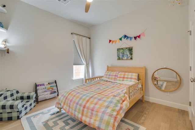 3824 Library Ln, Edmond, OK 73034 - bedroom with wood finished floors and ceiling fan