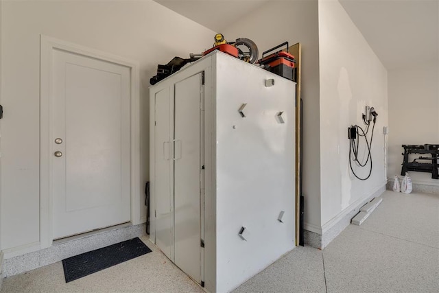 3824 Library Ln, Edmond, OK 73034 - interior space with speckled floor and baseboards