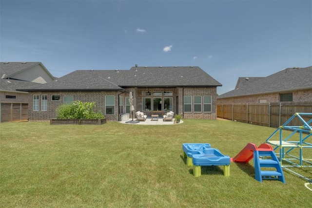 3824 Library Ln, Edmond, OK 73034 - rear view of house featuring a fenced backyard, brick siding, a patio, and a shingled roof