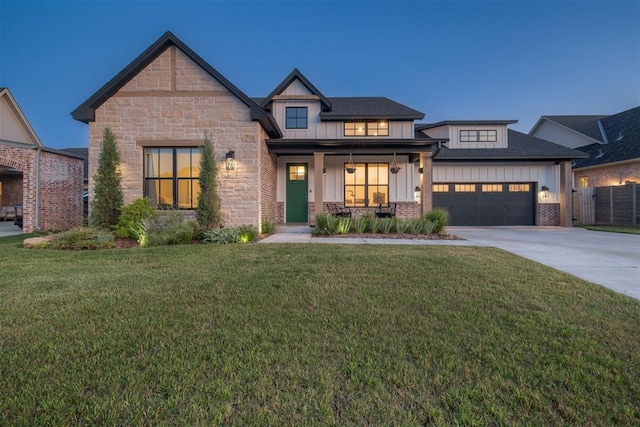 3824 Library Ln, Edmond, OK 73034 - view of front of property with board and batten siding, covered porch, a garage, and driveway