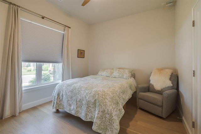 3824 Library Ln, Edmond, OK 73034 - bedroom featuring wood finished floors and a ceiling fan