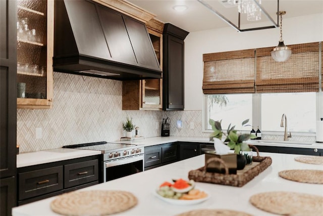 118900 S 4213th Rd, Eufaula, OK 74432 - kitchen featuring custom range hood, stainless steel range with electric cooktop, light countertops, and decorative light fixtures