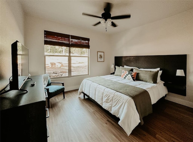 118900 S 4213th Rd, Eufaula, OK 74432 - bedroom with wood finished floors and a ceiling fan