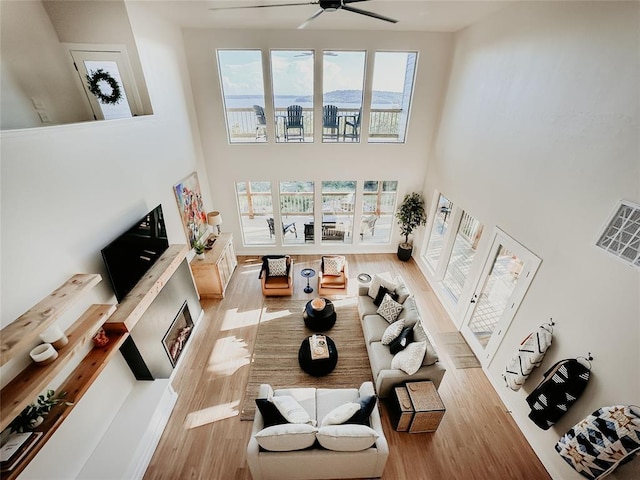 118900 S 4213th Rd, Eufaula, OK 74432 - living area with a towering ceiling, light wood finished floors, and ceiling fan