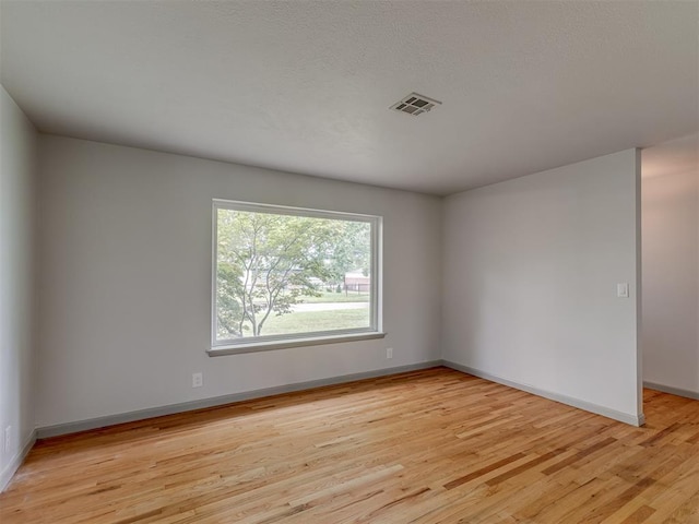 2822 N Market Ave, Shawnee, OK 74804 - empty room featuring light wood-style floors and baseboards