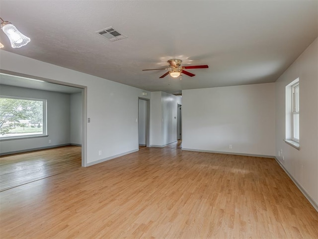 2822 N Market Ave, Shawnee, OK 74804 - empty room with light wood-type flooring and a ceiling fan