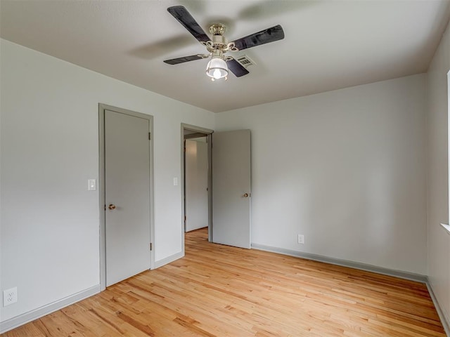 2822 N Market Ave, Shawnee, OK 74804 - empty room featuring light wood finished floors and ceiling fan