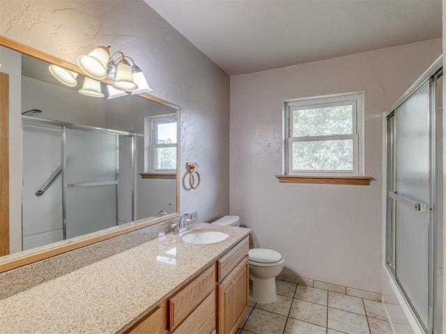 2822 N Market Ave, Shawnee, OK 74804 - bathroom featuring vanity, tile patterned flooring, and a textured wall