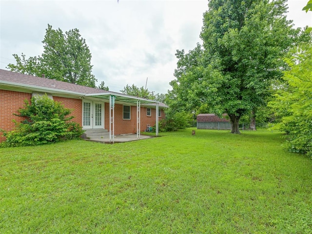 2822 N Market Ave, Shawnee, OK 74804 - view of green lawn with french doors and a patio area