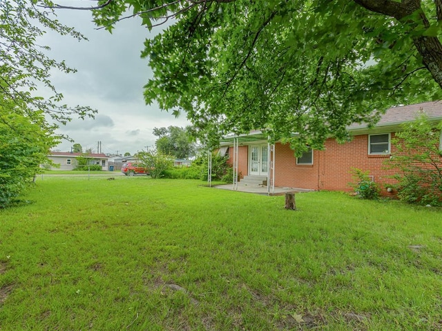 2822 N Market Ave, Shawnee, OK 74804 - view of green lawn featuring french doors, a patio area, and entry steps