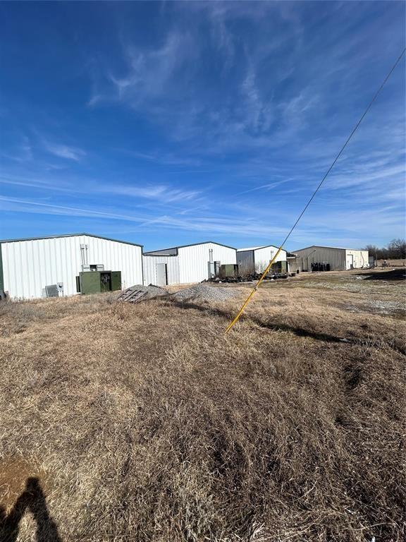146 Sunshine Rd, Mcalester, OK 74501 - view of yard featuring an outdoor structure and an outbuilding