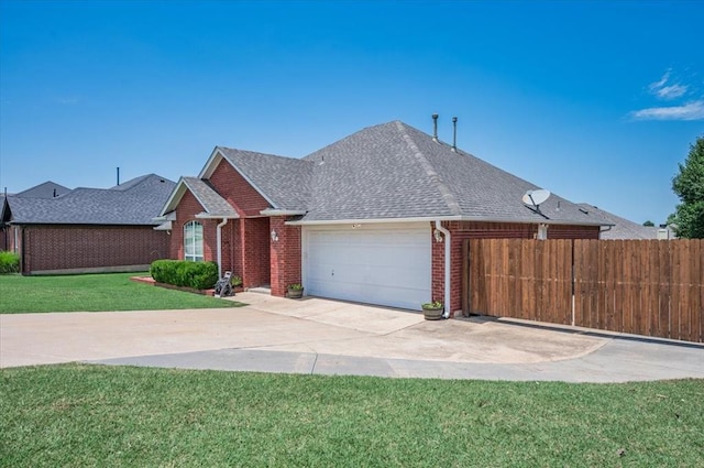 11517 Brighton Ct, Midwest City, OK 73130 - view of front of home with an attached garage, brick siding, a shingled roof, and driveway
