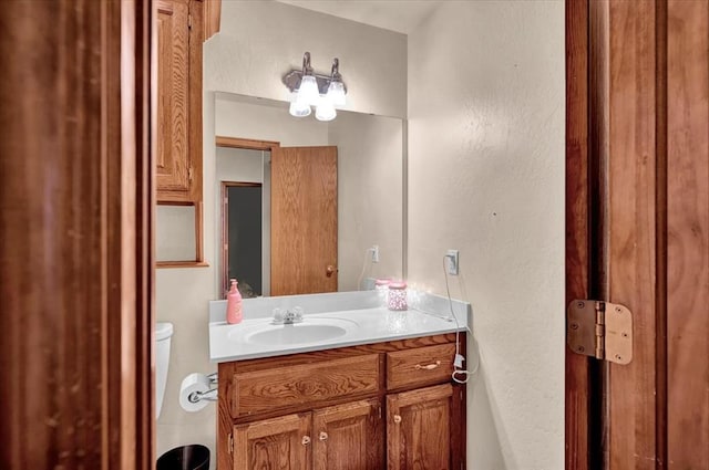 11517 Brighton Ct, Midwest City, OK 73130 - bathroom featuring vanity and a textured wall