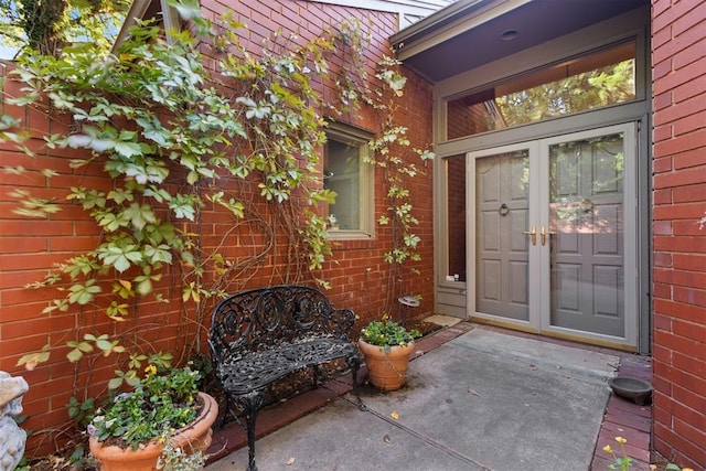 2825 NW Grand Blvd Unit 3, Oklahoma City, OK 73116 - doorway to property with brick siding and french doors