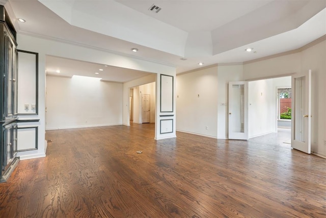 2825 NW Grand Blvd Unit 3, Oklahoma City, OK 73116 - unfurnished living room featuring wood finished floors, recessed lighting, ornamental molding, and a raised ceiling